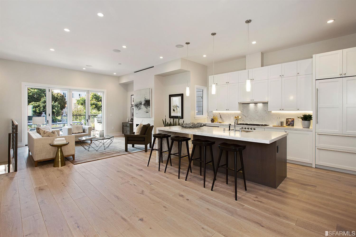 Kitchen area island counter with stools SF residence image #1