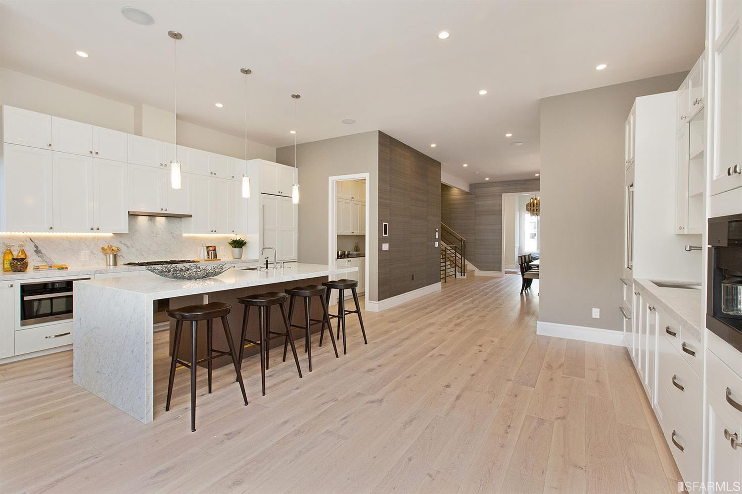 Kitchen area island counter with stools SF residence image #2