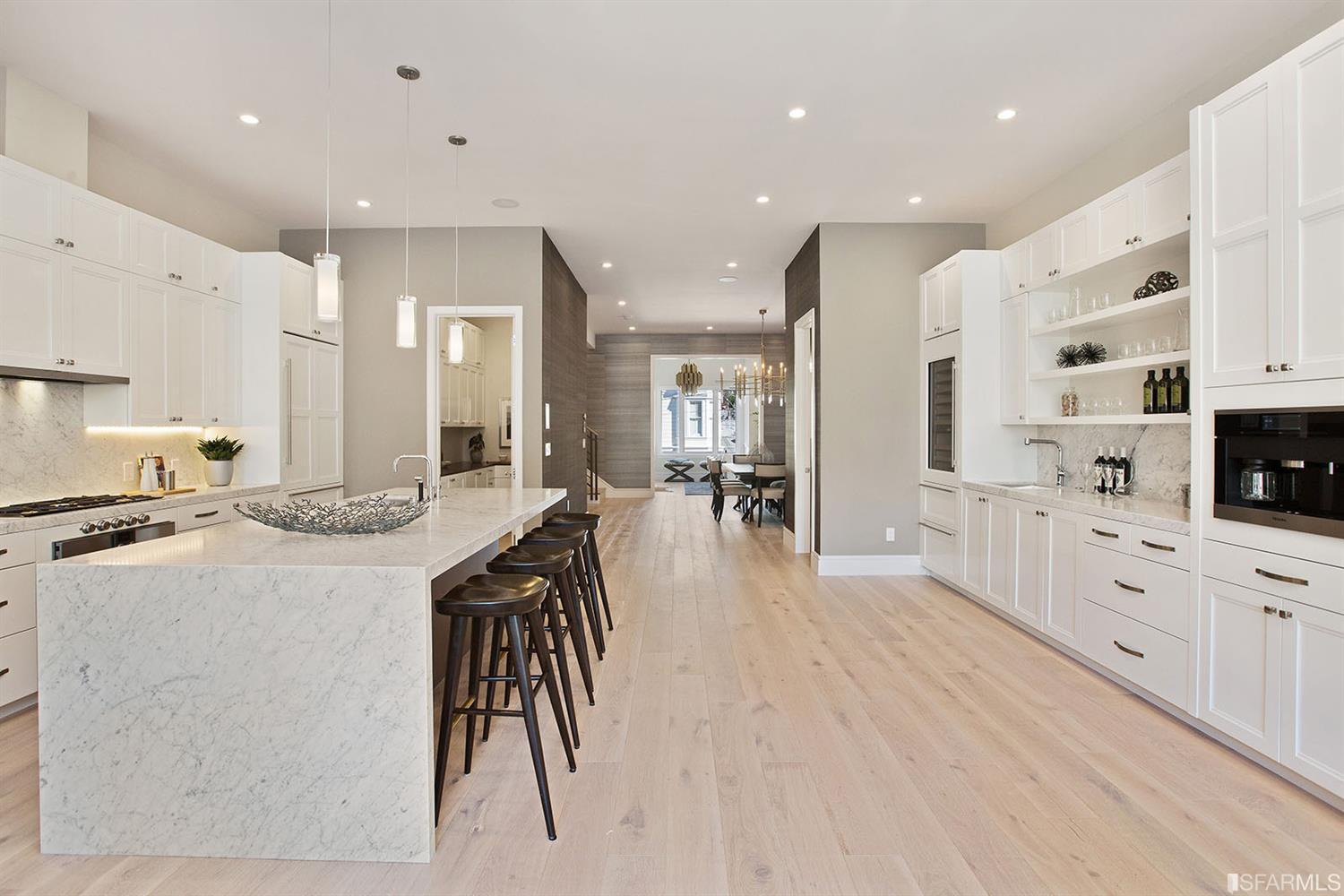 Kitchen area island counter with stools SF residence image #3