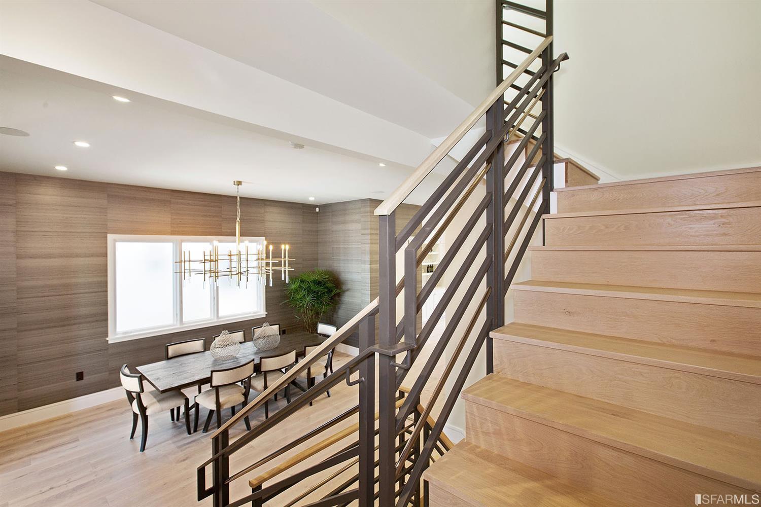 Stairway with metal banister SF residence