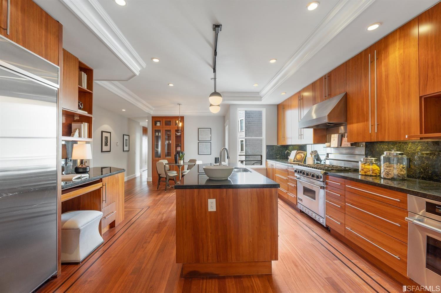 217-219 16th Avenue Kitchen with beautiful hardwood cabinets and floors. 