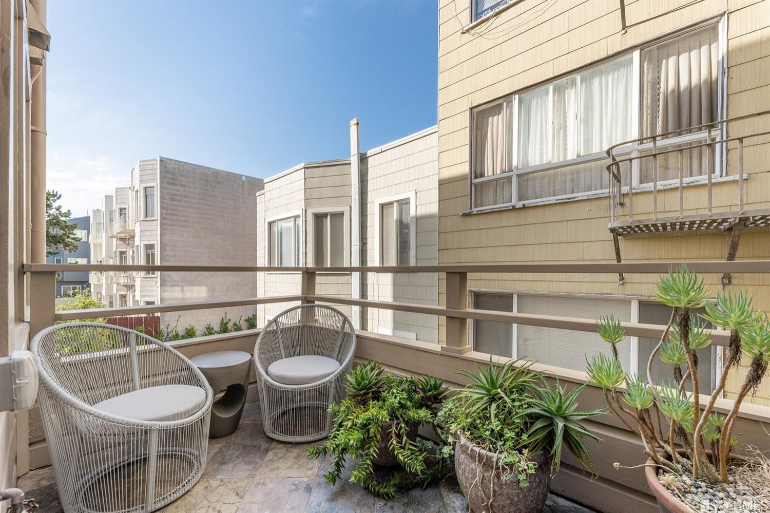 217-219 16th Avenue Outside deck with plants and patio furniture.