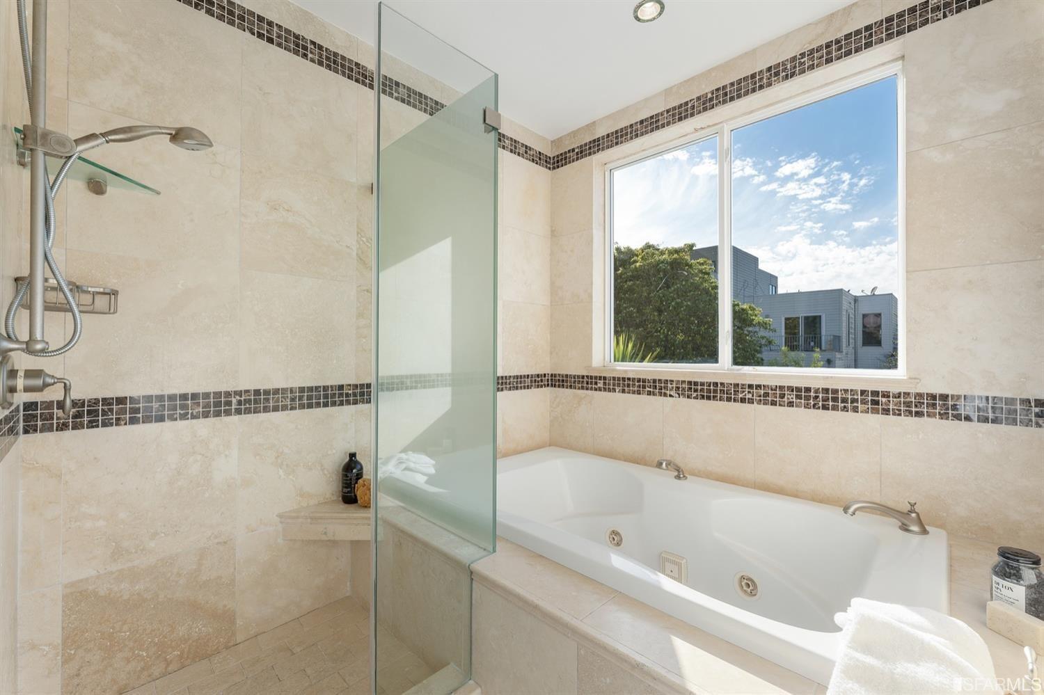 217-219 16th Avenue Close up of marble master bath with tub and view of neighborhood.